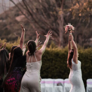 Bouquet Toss Tradition Explained (And Its Origins)